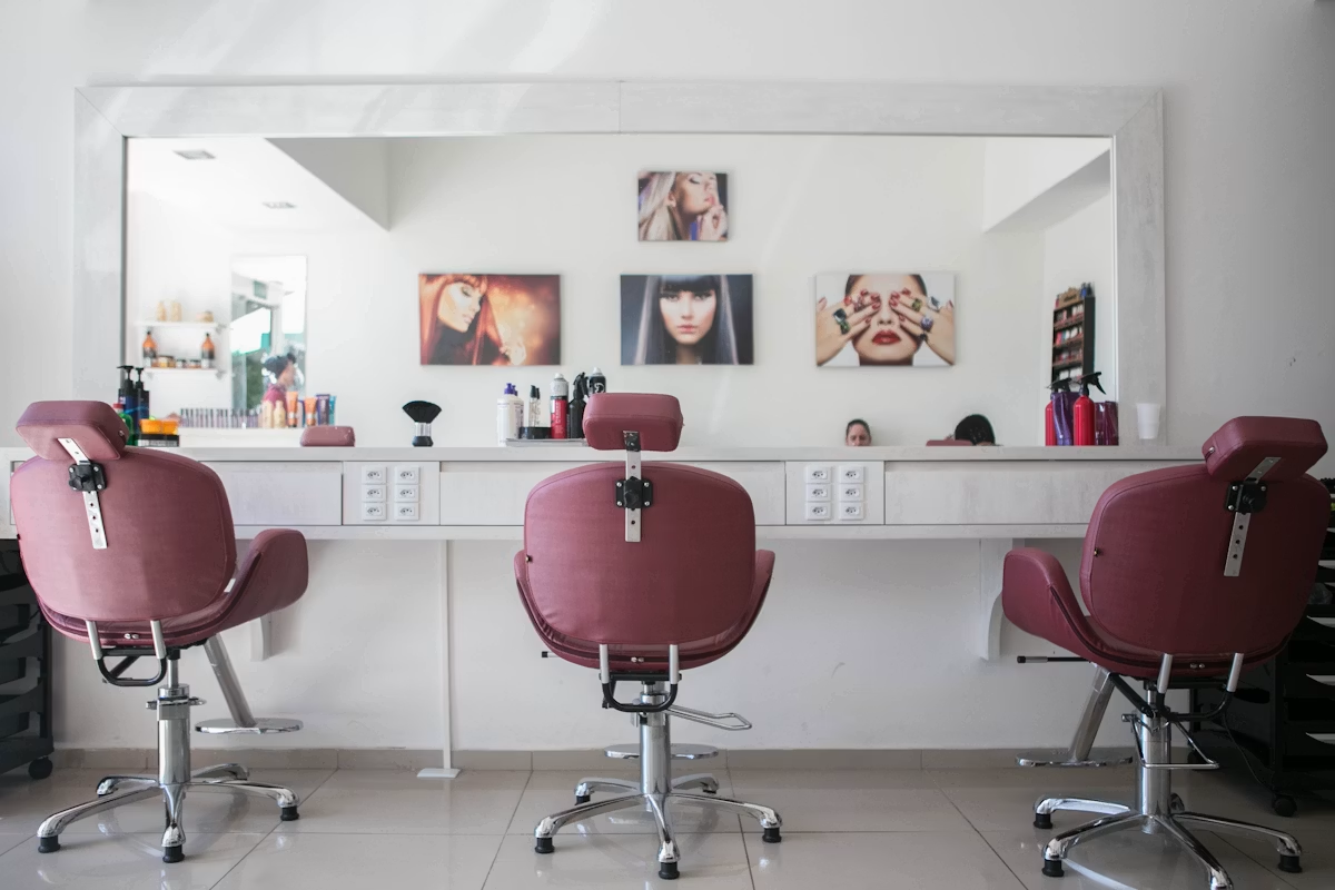 Beauty professionals working in a modern salon